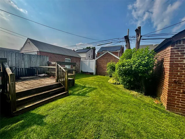 a view of a backyard with hardwood