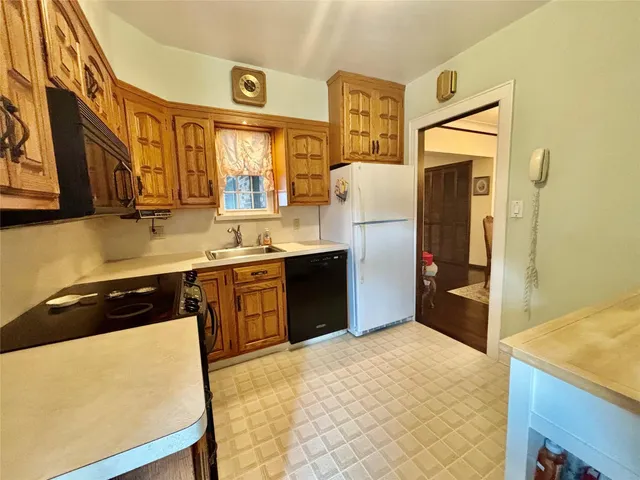a kitchen with stainless steel appliances a refrigerator and a stove