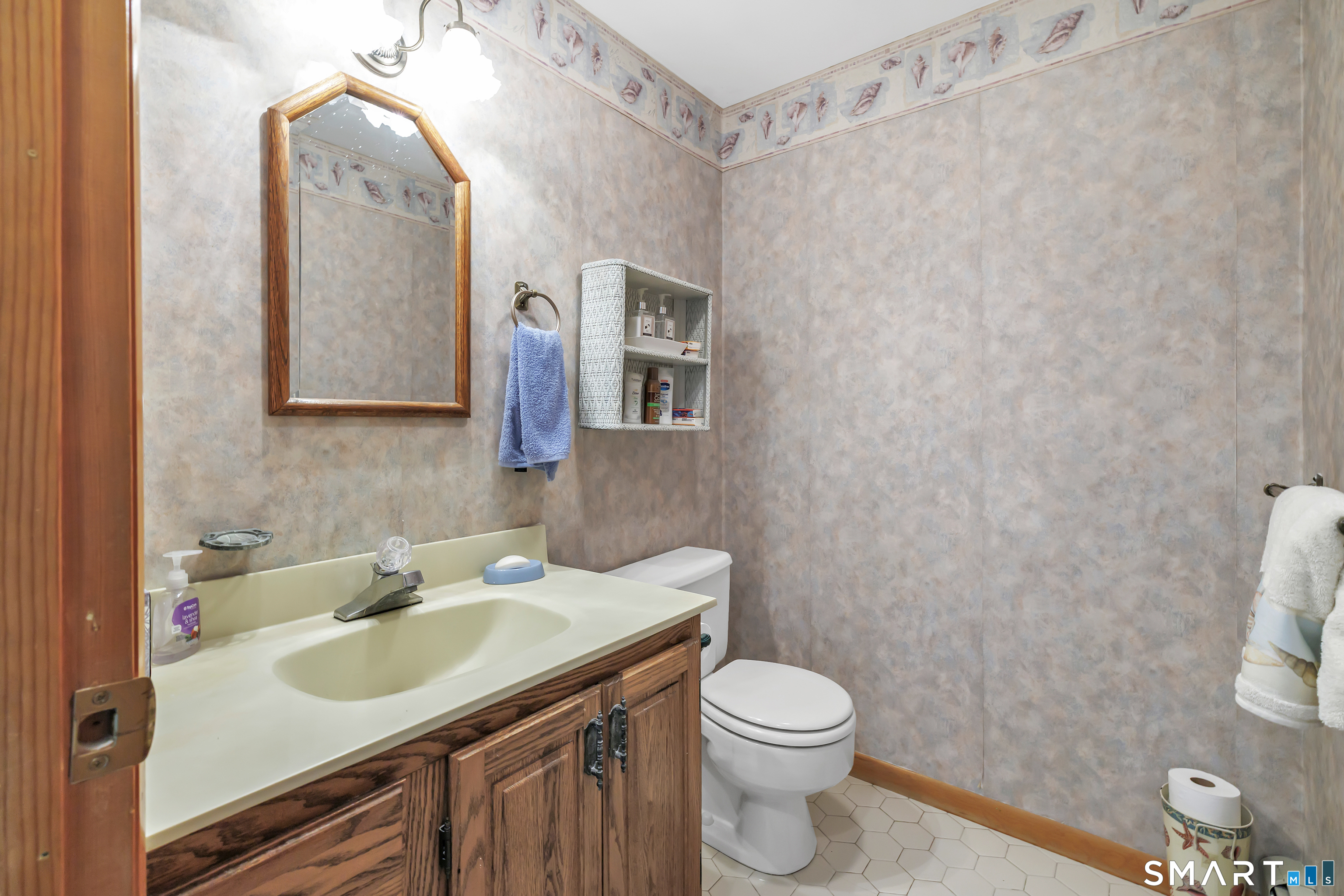 223 Wheeler Road Monroe, CT 06468 - Photo 17 of 35 a bathroom with a sink a toilet and mirror