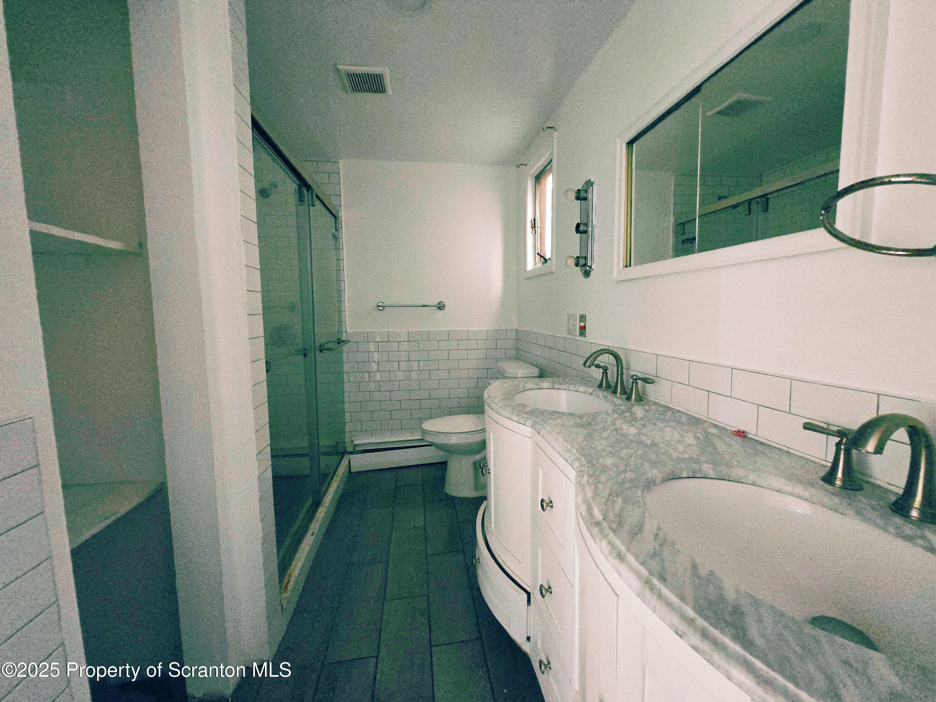 321 Prospect Avenue Scranton, PA 18505 - Photo 13 of 21 a bathroom with a granite countertop sink a mirror and a bathtub
