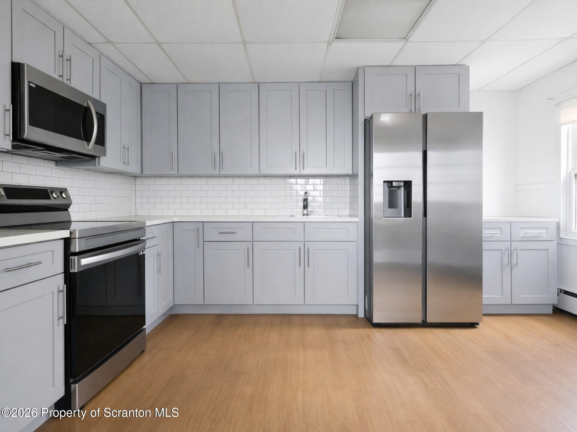321 Prospect Avenue Scranton, PA 18505 - Photo 2 of 13 a kitchen with a sink stainless steel appliances and cabinets
