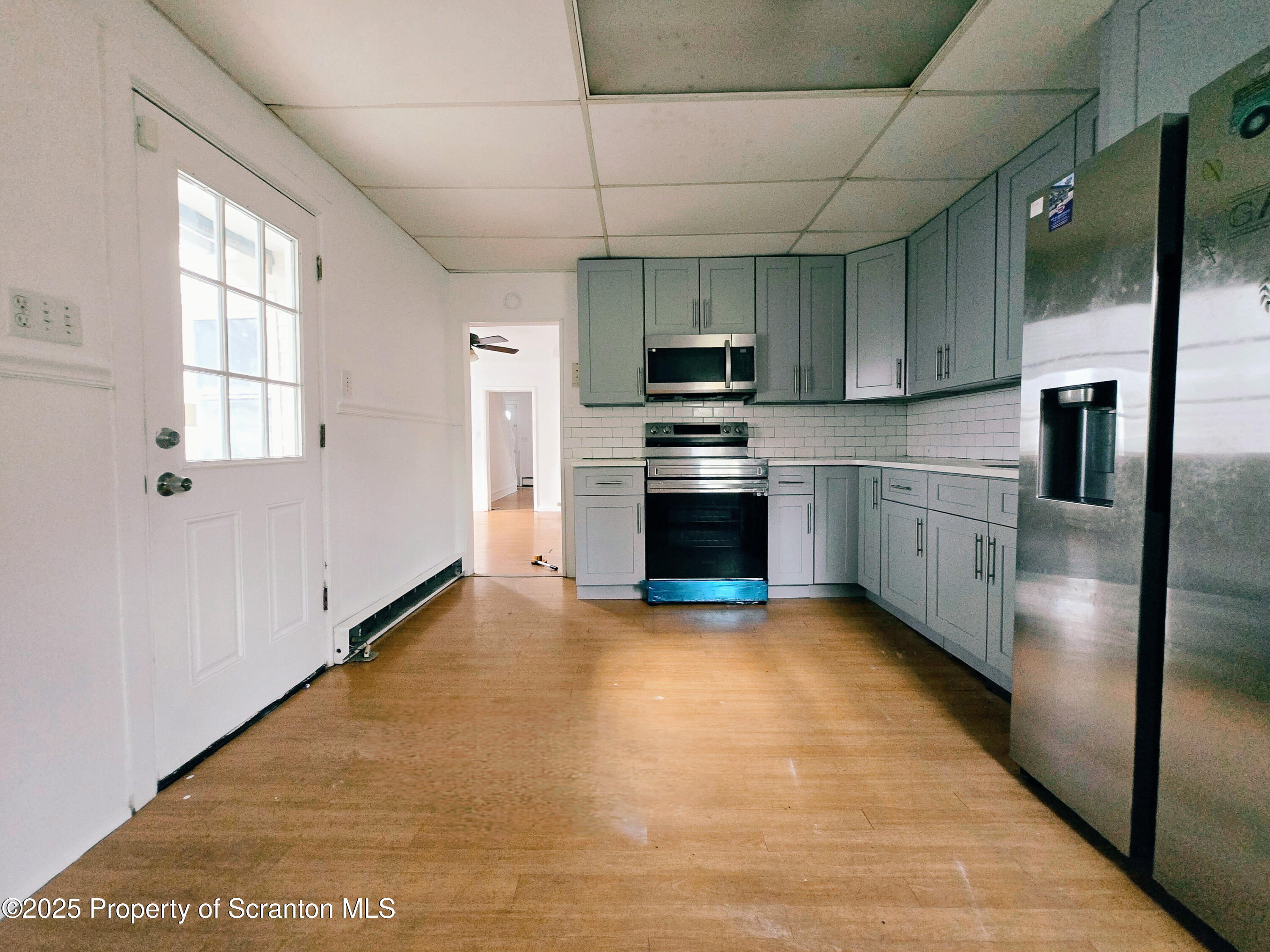 321 Prospect Avenue Scranton, PA 18505 - Photo 7 of 21 a kitchen with stainless steel appliances granite countertop a refrigerator a stove and a sink