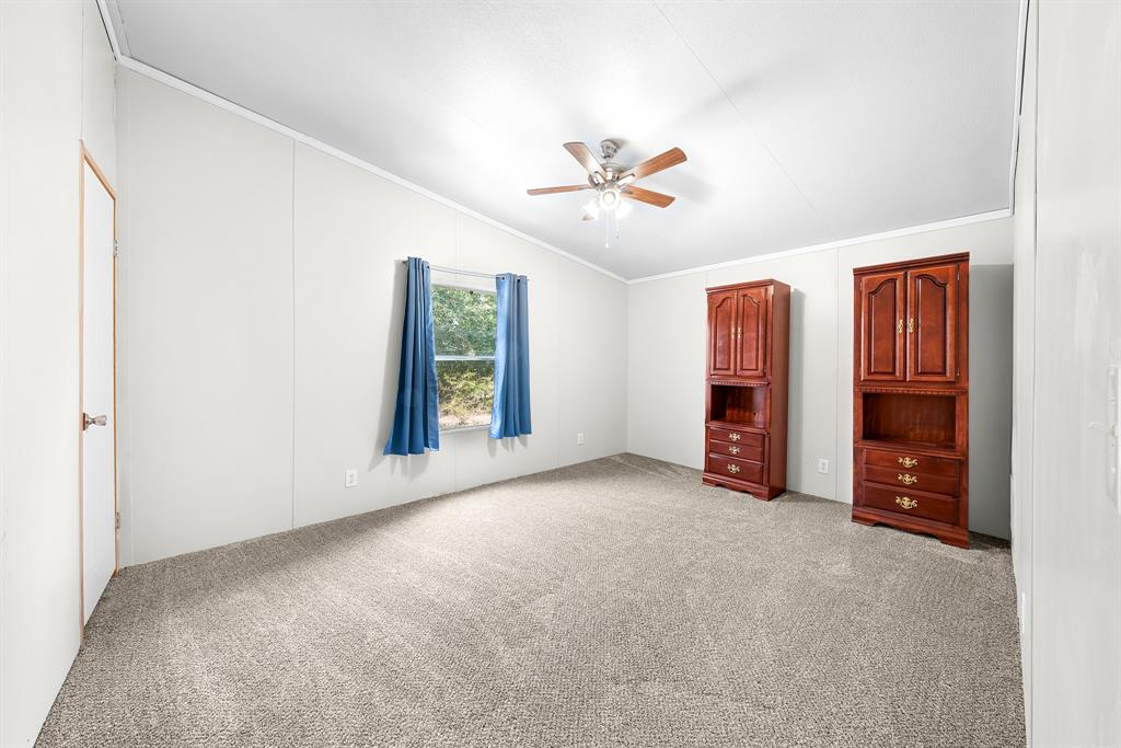 366 Tony Lane Fate, TX 75189 - Photo 24 of 36 a view of an empty room with closet and fan
