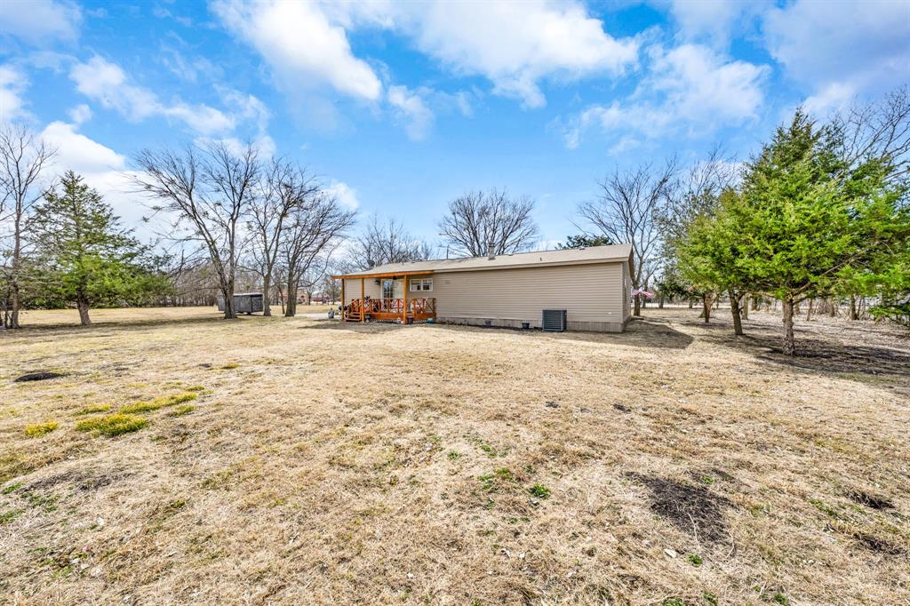 366 Tony Lane Fate, TX 75189 - Photo 30 of 36 a view of a yard with large tree