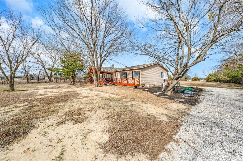 366 Tony Lane Fate, TX 75189 - Photo 7 of 36 a view of a yard with a large tree