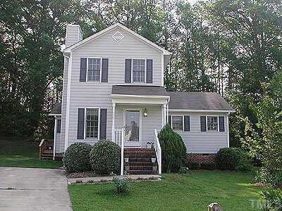3921 Olde Coach Road Durham, NC 27707 - Photo 1 of 1 a front view of a house with a yard