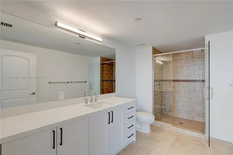 a view of a room with wooden floor and window