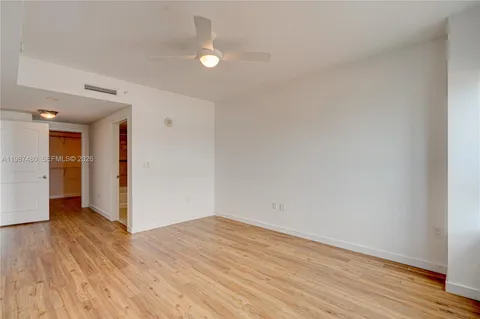 a bathroom with a sink toilet vanity and shower