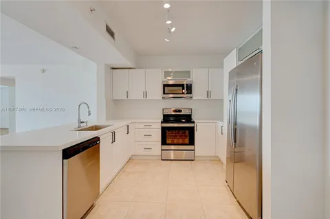 a kitchen with a stove and a microwave