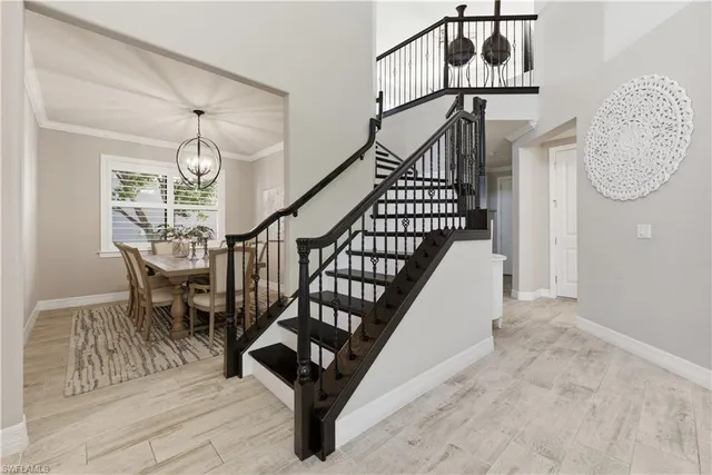 a view of entryway dining room and hall with wooden floor
