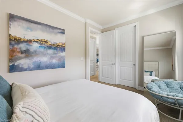 a bedroom with a bed and a bathroom