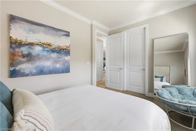 a bedroom with a bed and a bathroom