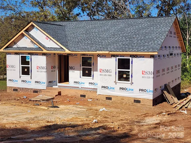 a view of house with wooden floor and outdoor space