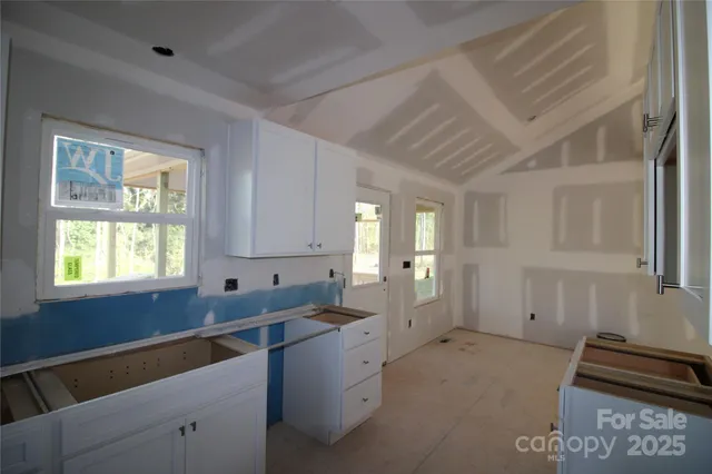 a kitchen that has a sink and a stove in it