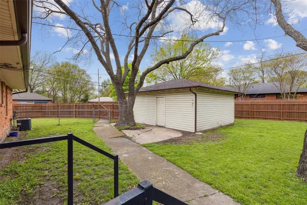 a view of a backyard with a garden