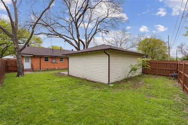 a backyard of a house with lots of green space