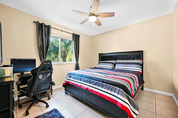 a bedroom with a bed and a desk