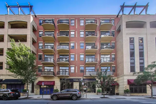 a front view of a building with a street