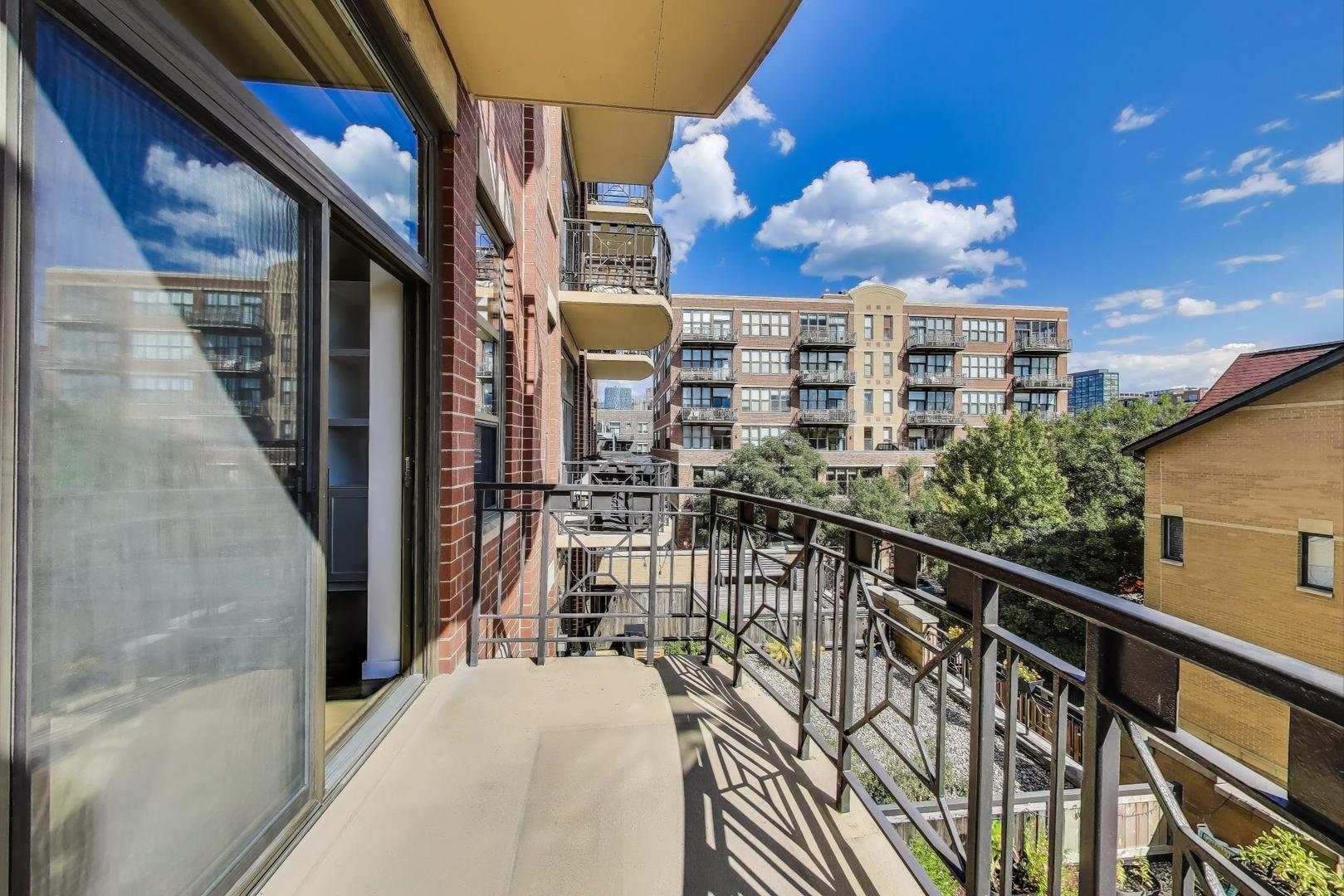 1301 West Madison Street, Unit 311 Chicago, IL 60607 - Photo 12 of 21 a view of a balcony with city view