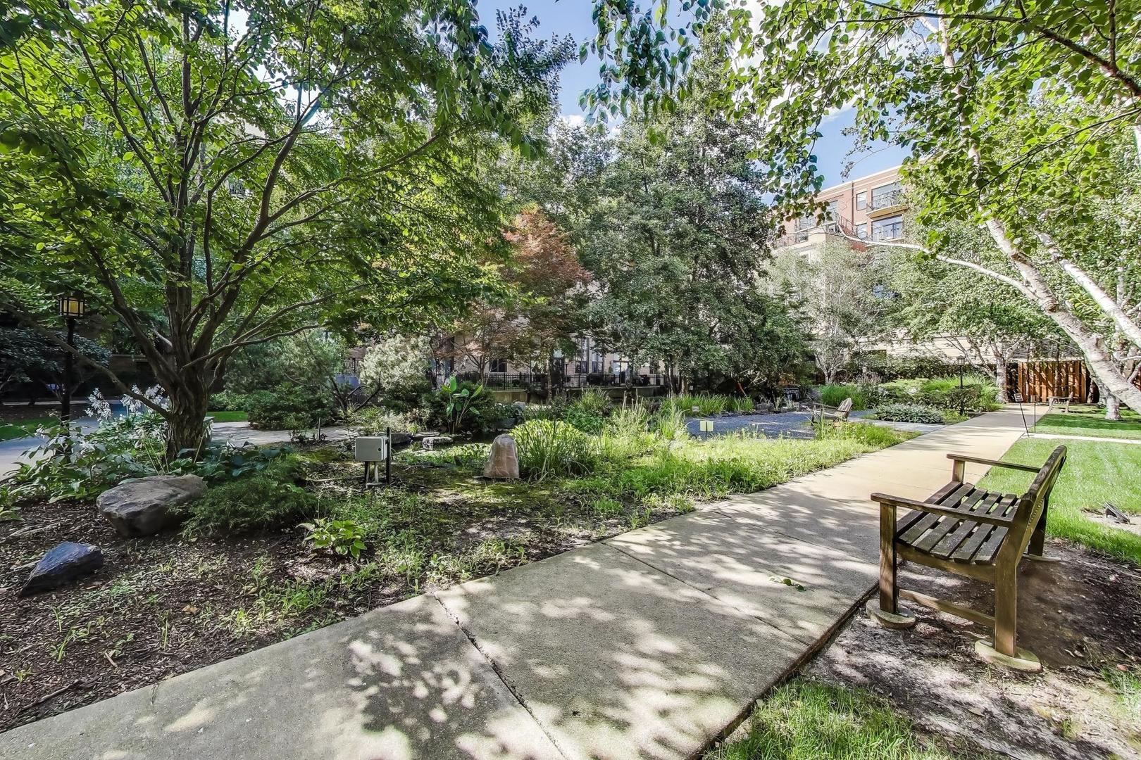 1301 West Madison Street, Unit 311 Chicago, IL 60607 - Photo 19 of 21 a view of backyard with outdoor seating and green space