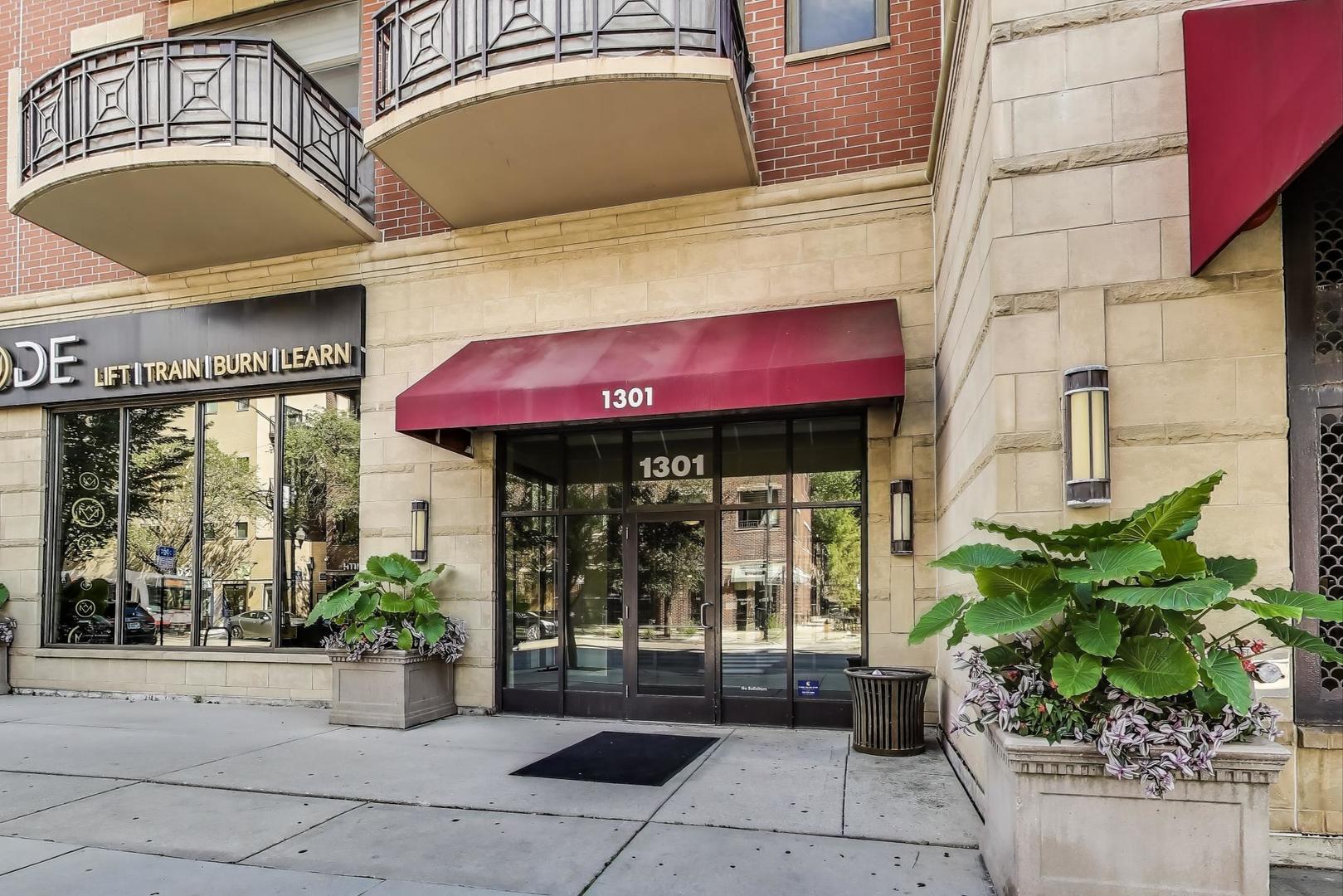 1301 West Madison Street, Unit 311 Chicago, IL 60607 - Photo 3 of 21 a potted plant sitting in front of a building