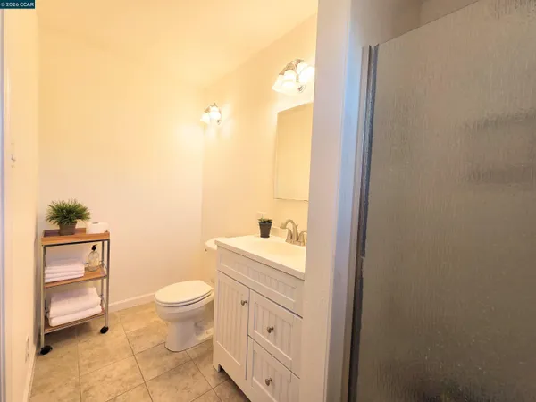 a view of a backyard with wooden fence