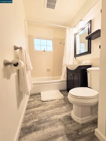 a building outdoor space with patio furniture and potted plants