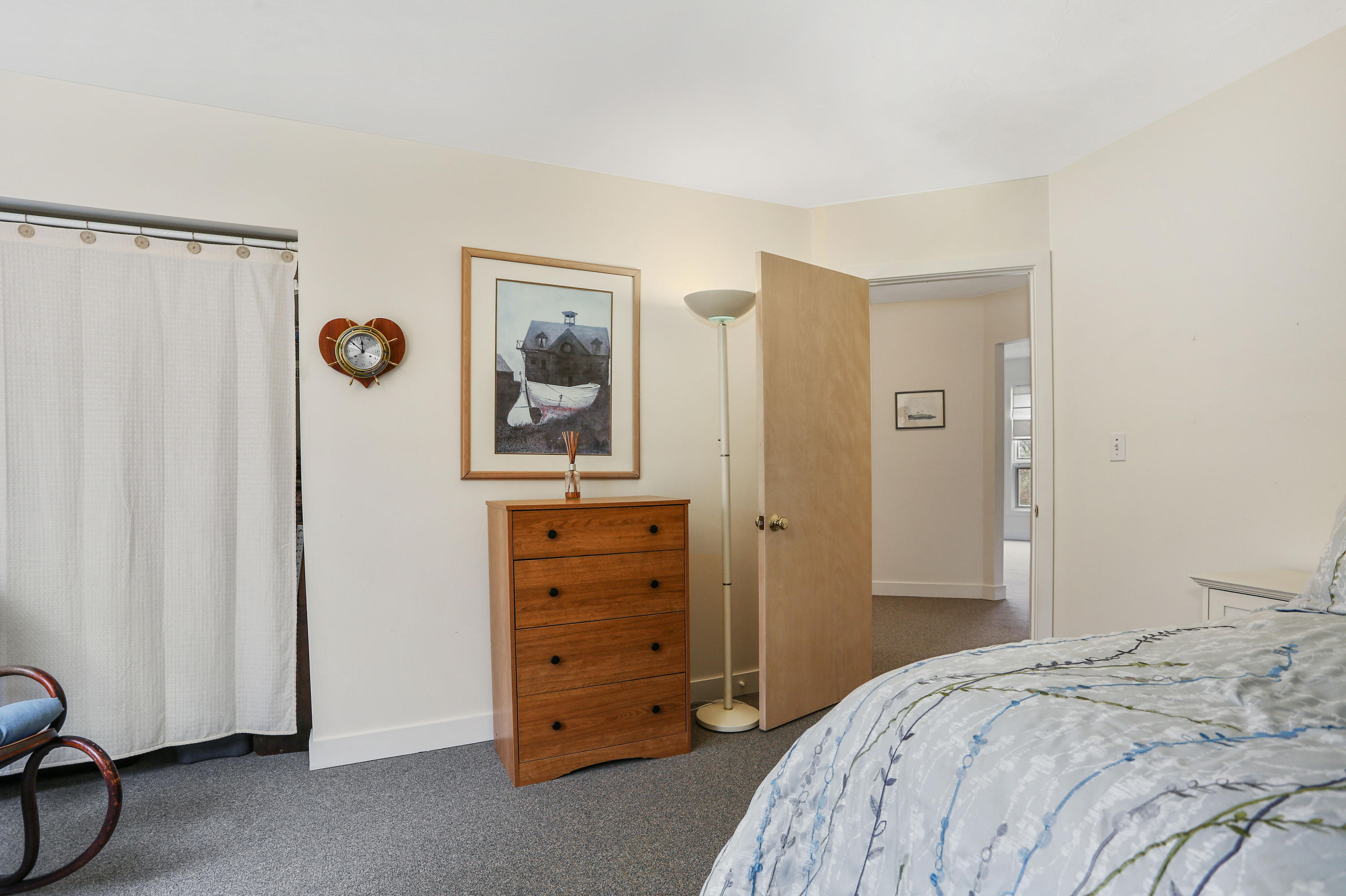 38 Weather Deck Road Bourne, MA 02532 - Photo 11 of 40 a bedroom with a bed and a mirror