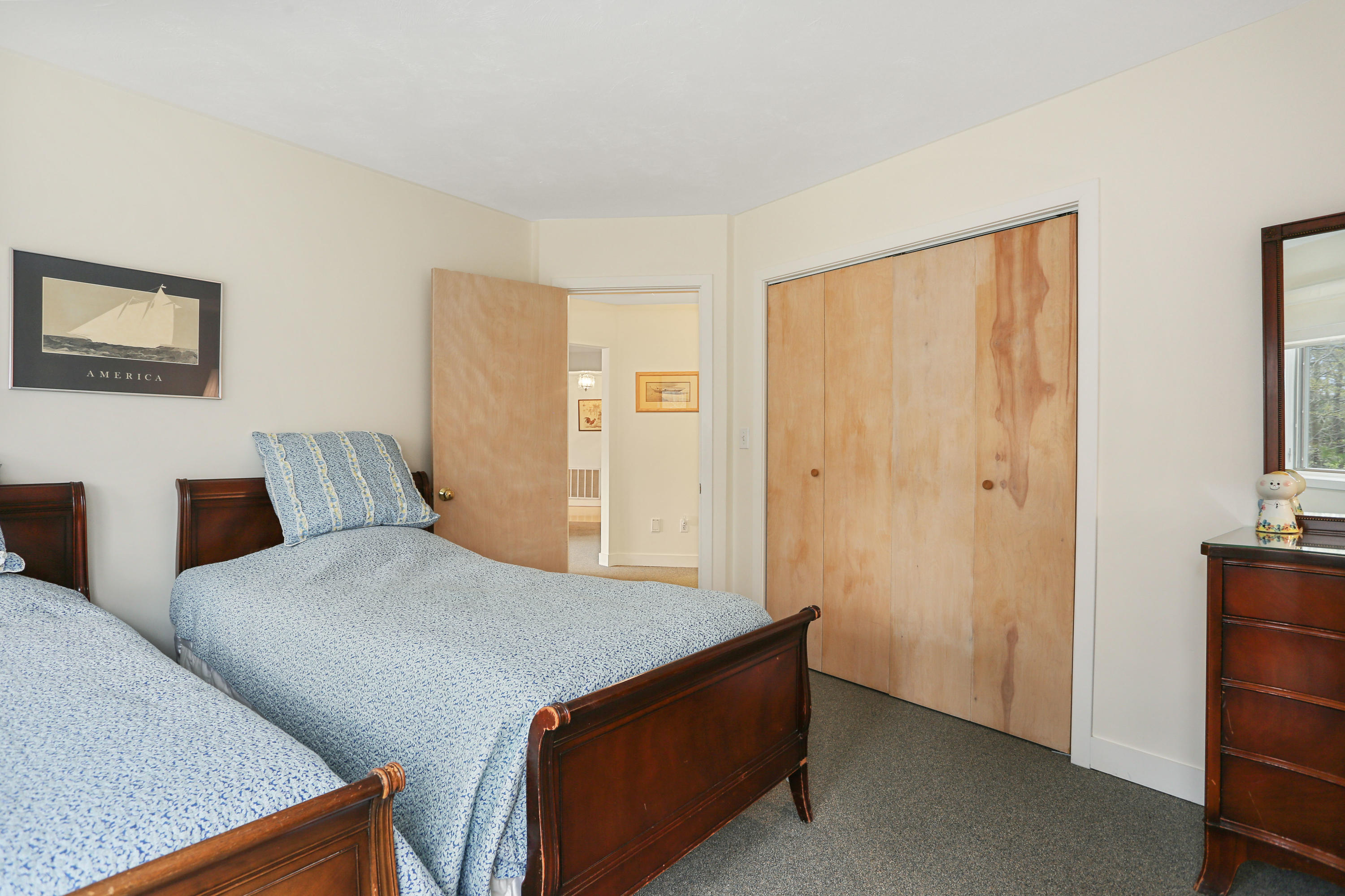 38 Weather Deck Road Bourne, MA 02532 - Photo 13 of 40 a bedroom with a bed and a dresser