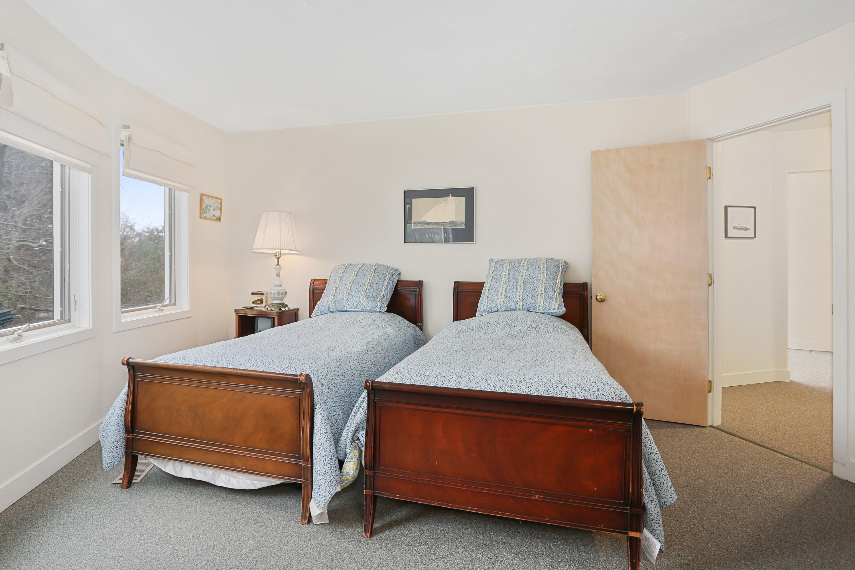 38 Weather Deck Road Bourne, MA 02532 - Photo 14 of 40 a bedroom with two beds and a window