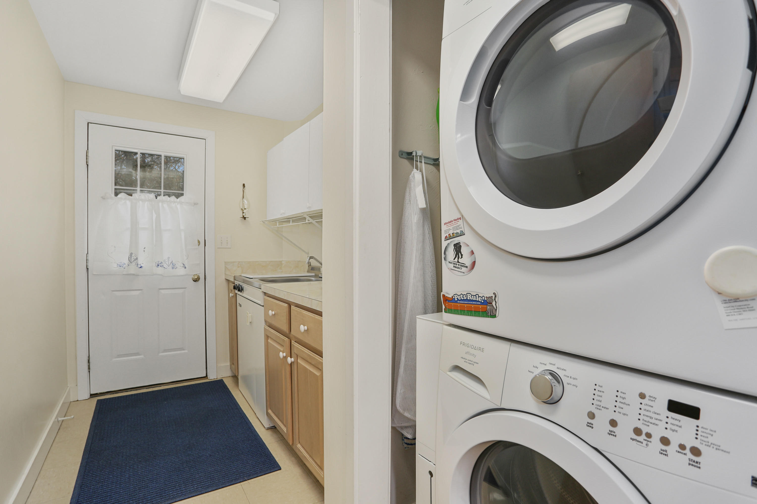 38 Weather Deck Road Bourne, MA 02532 - Photo 15 of 40 a view of a hallway with washer and dryer