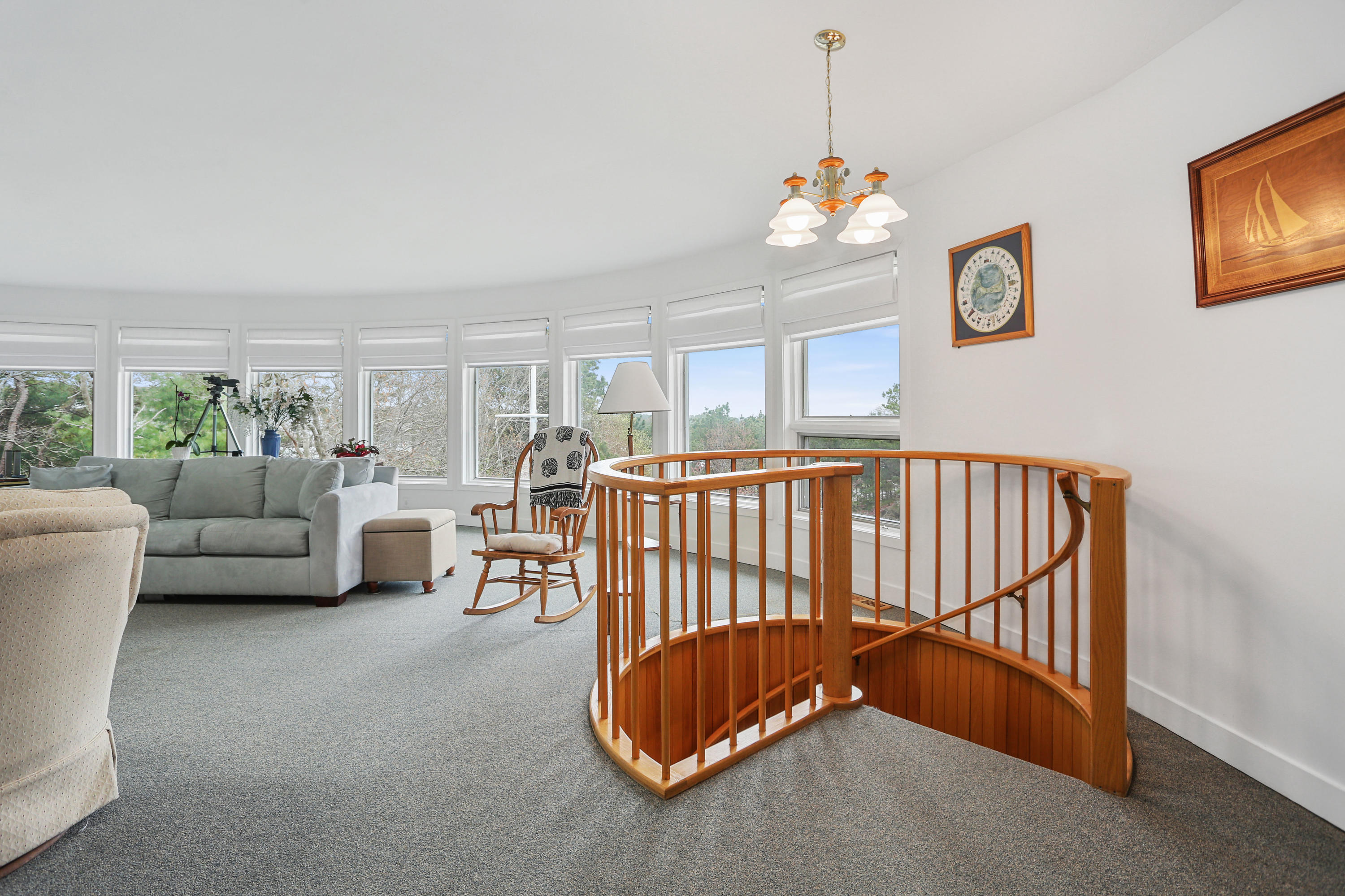 38 Weather Deck Road Bourne, MA 02532 - Photo 16 of 40 a living room with furniture and a chandelier