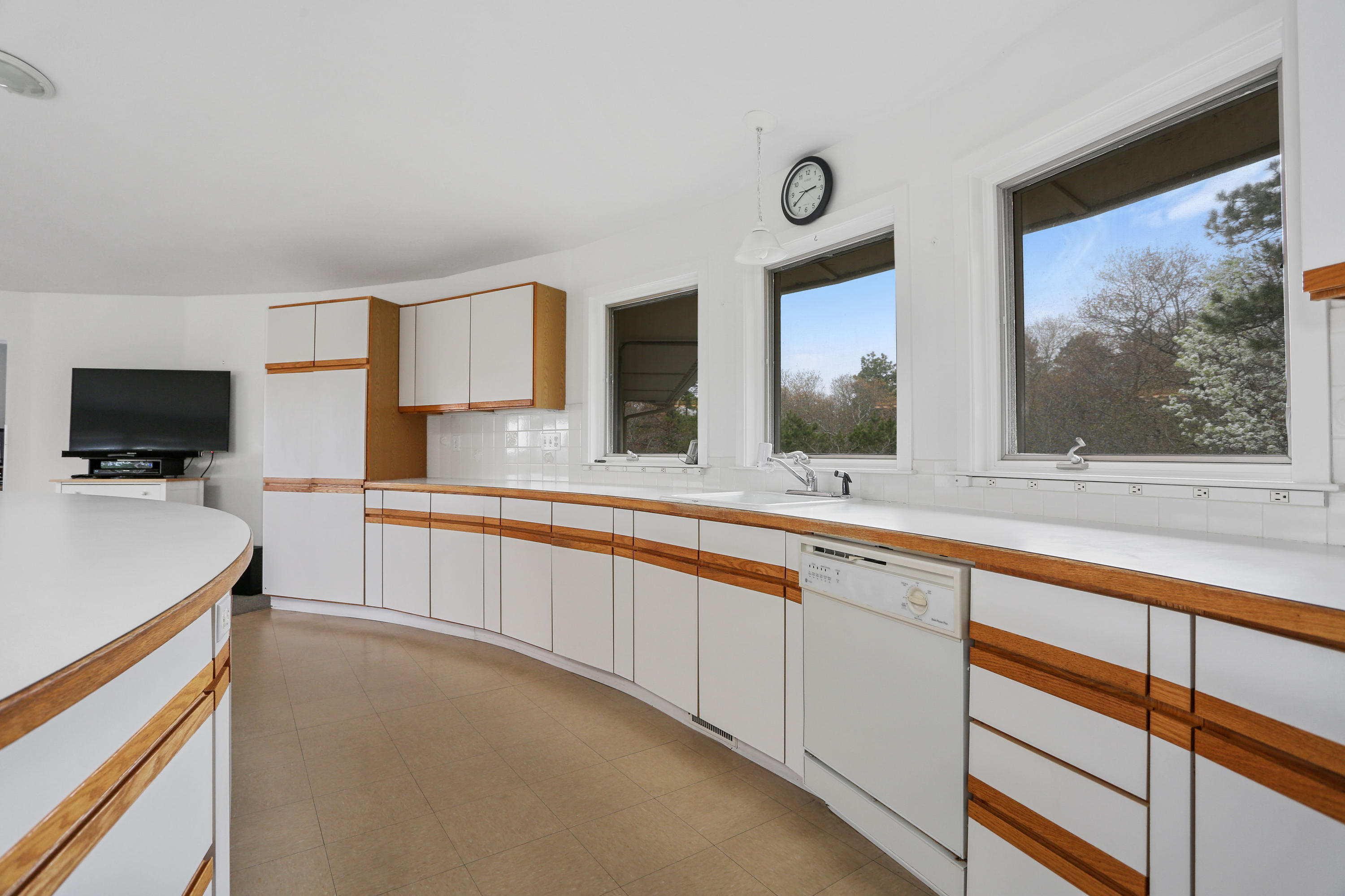38 Weather Deck Road Bourne, MA 02532 - Photo 24 of 40 a view of a kitchen with a sink and a large window