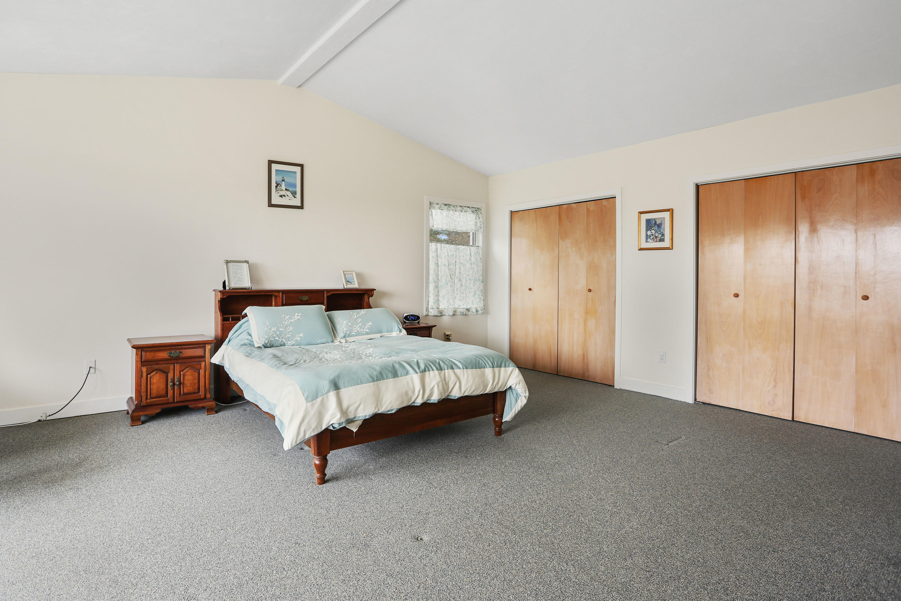 38 Weather Deck Road Bourne, MA 02532 - Photo 28 of 40 a spacious bedroom with a bed and a cabinets