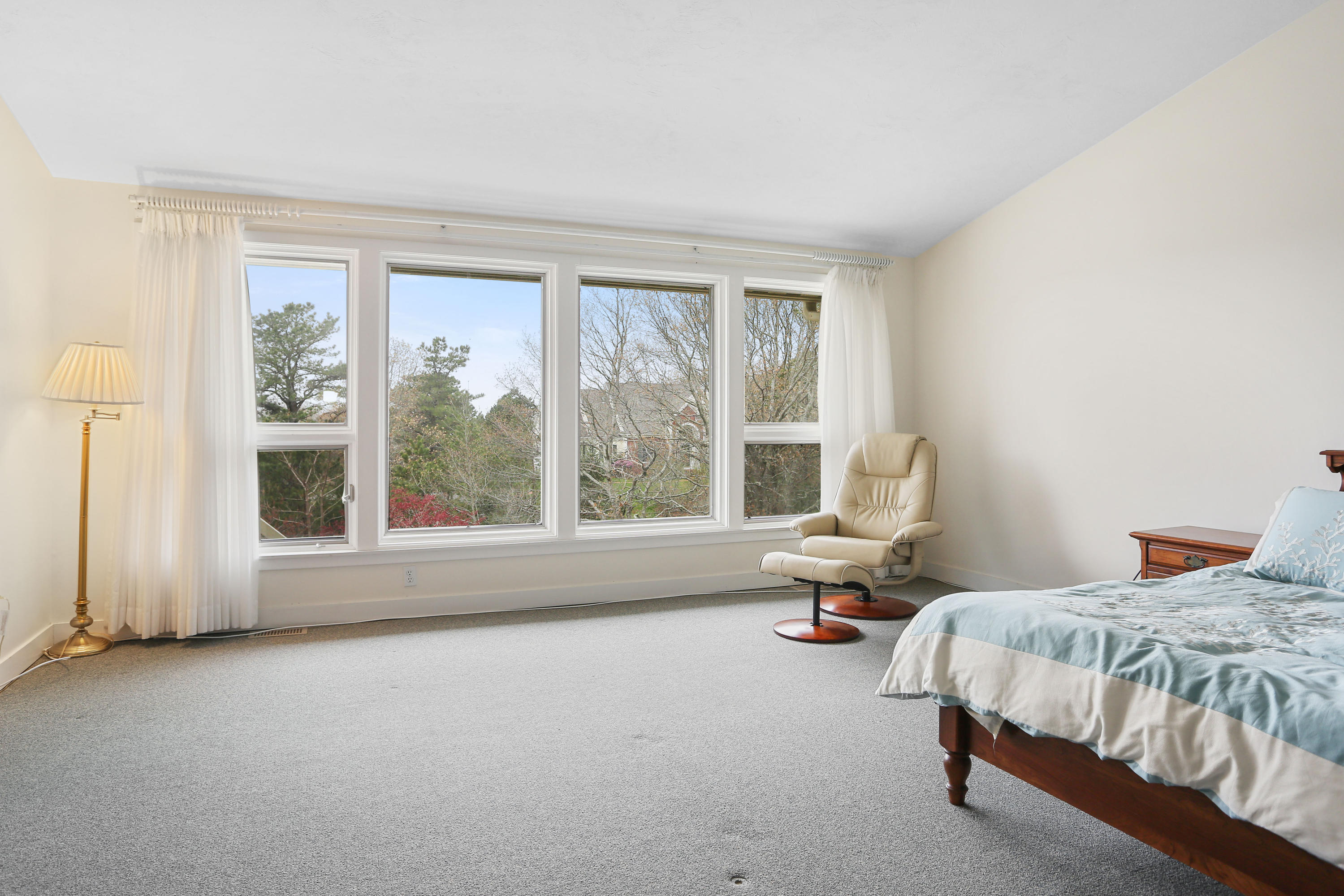 38 Weather Deck Road Bourne, MA 02532 - Photo 29 of 40 a bedroom with a bed and large window
