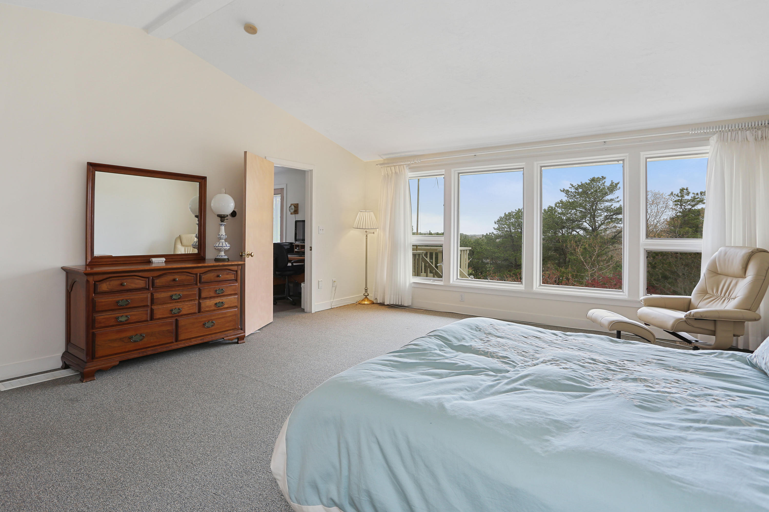 38 Weather Deck Road Bourne, MA 02532 - Photo 30 of 40 a bed sitting in a spacious bedroom next to a window
