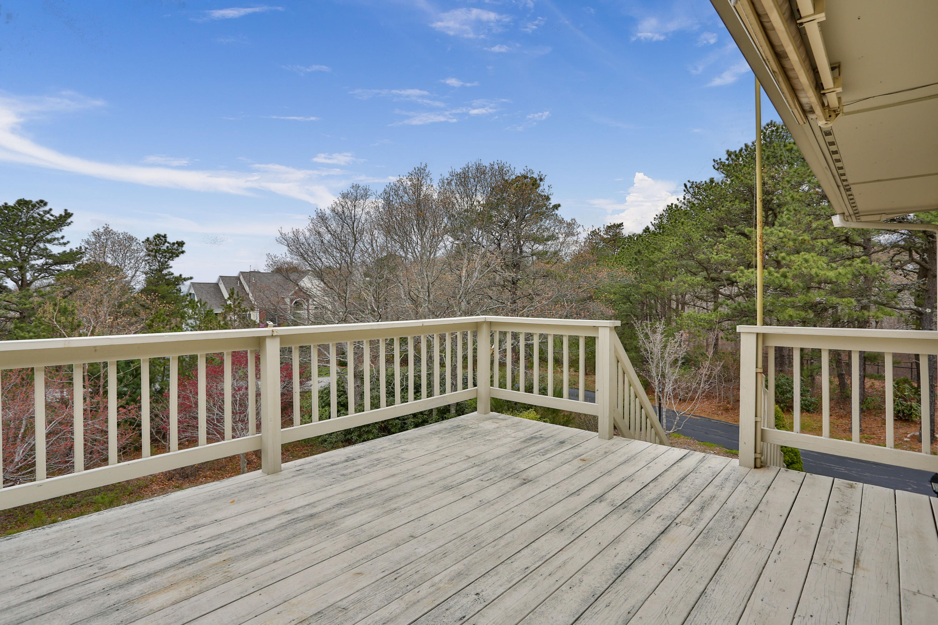 38 Weather Deck Road Bourne, MA 02532 - Photo 34 of 40 a view of balcony with wooden floor and fence