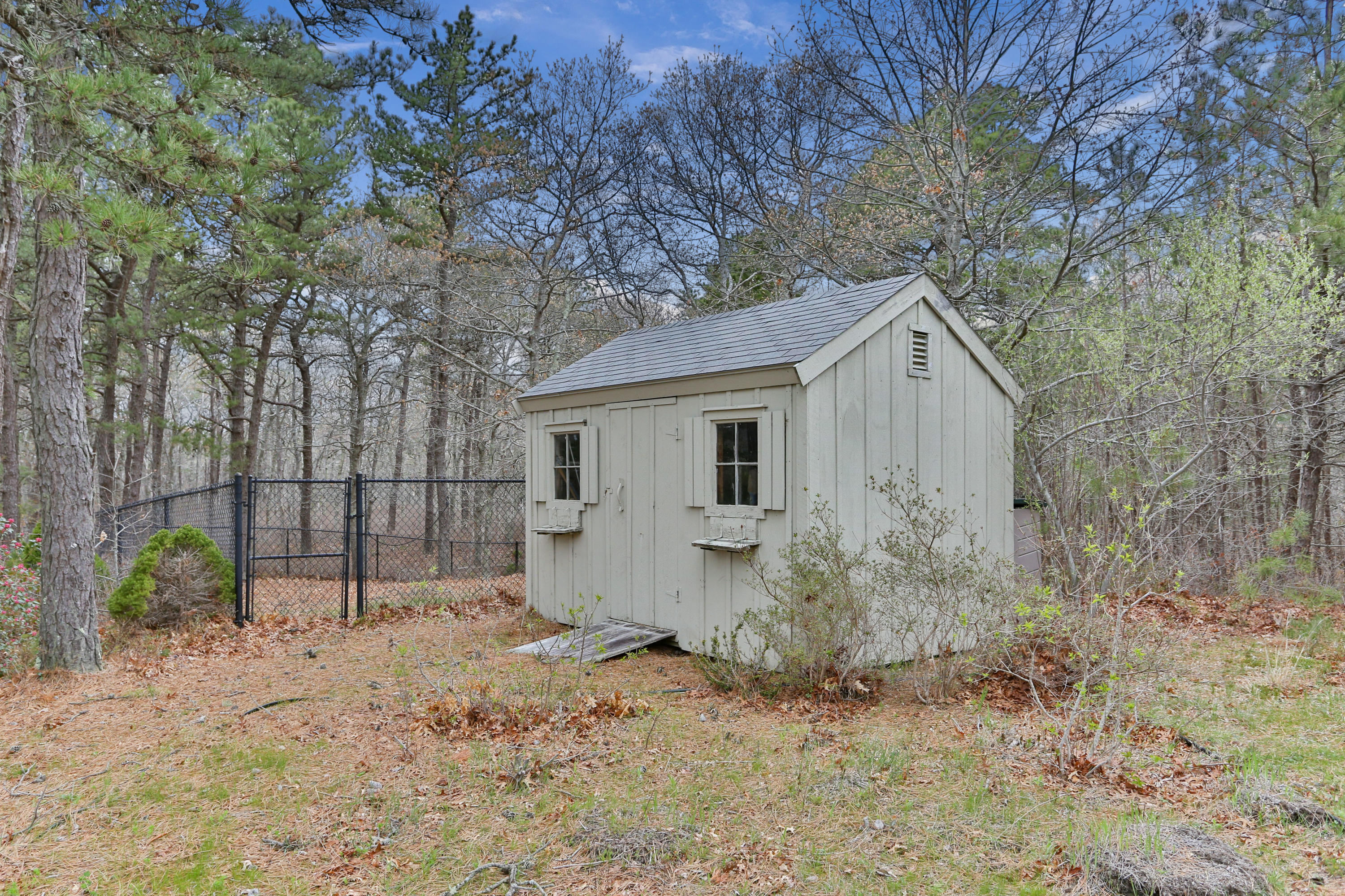 38 Weather Deck Road Bourne, MA 02532 - Photo 39 of 40 a view of a house with a yard and garage
