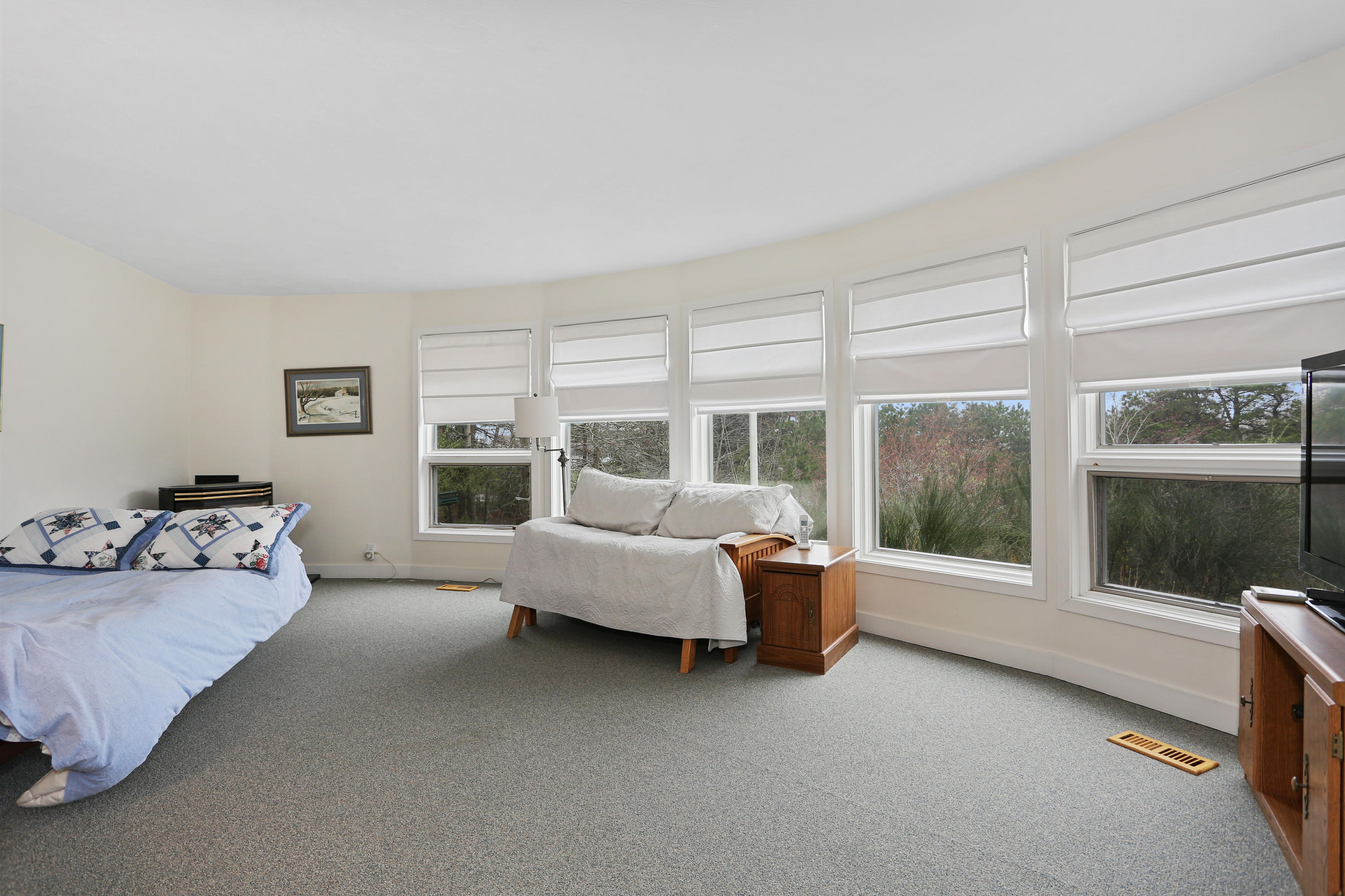 38 Weather Deck Road Bourne, MA 02532 - Photo 6 of 40 a living room with furniture and large windows