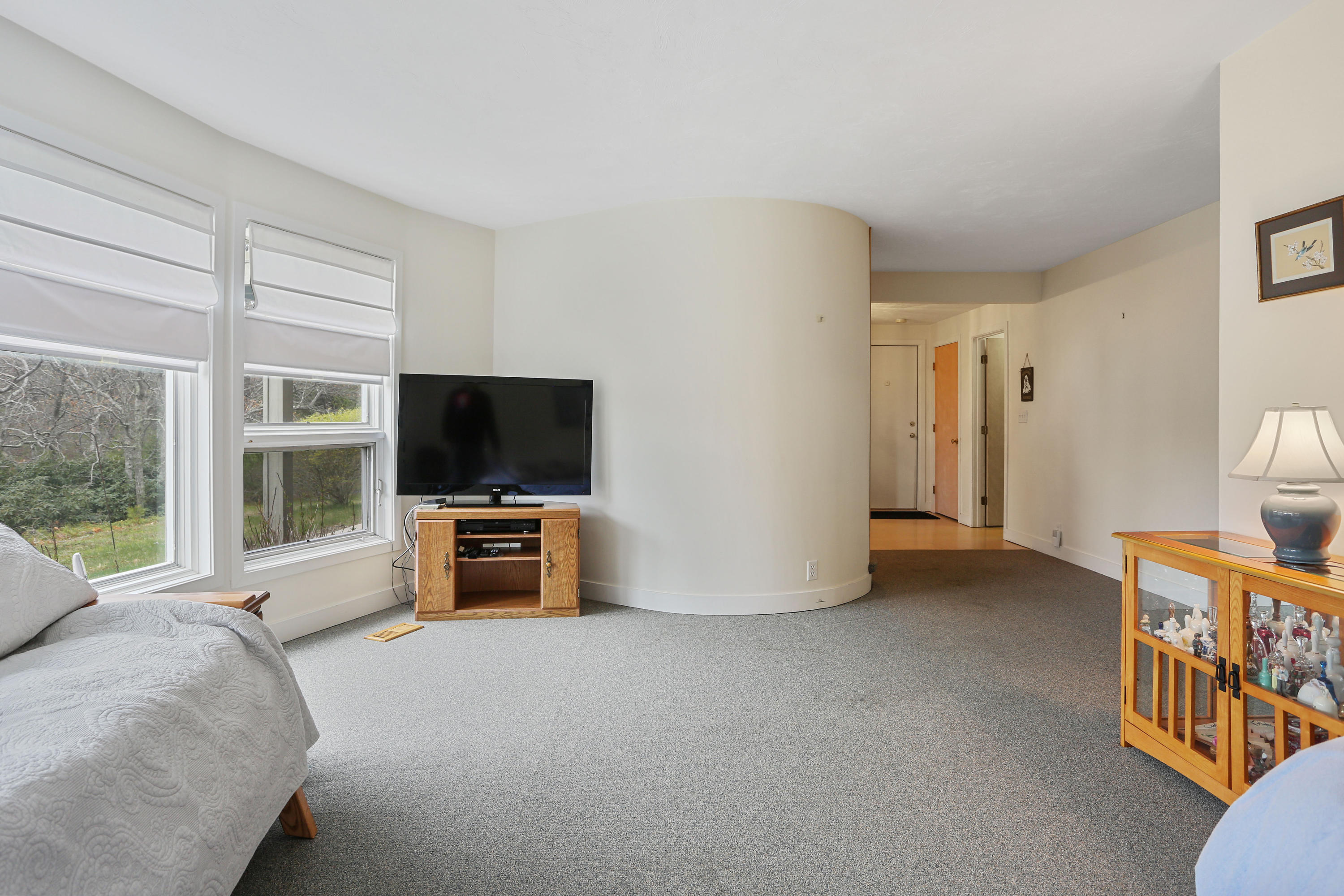 38 Weather Deck Road Bourne, MA 02532 - Photo 8 of 40 a living room with furniture and a flat screen tv