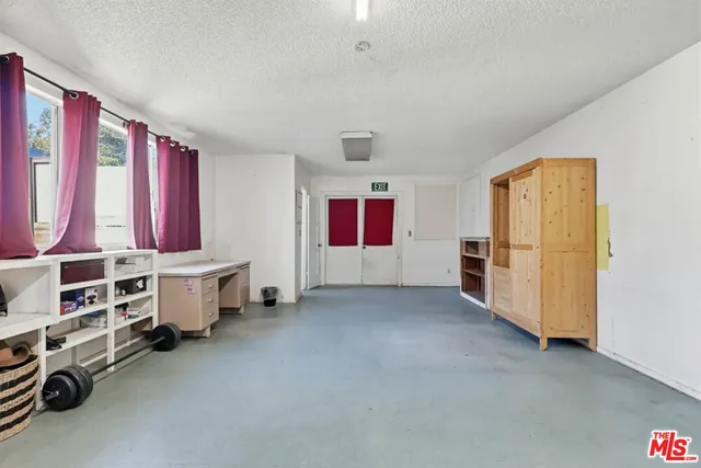 a bedroom with furniture and a wooden floor
