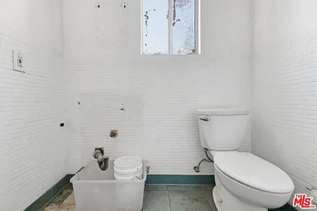 a view of living room filled with furniture and window