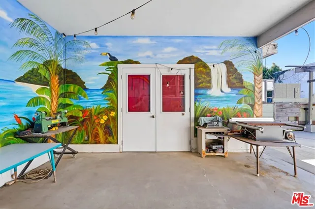 a bathroom with a shower curtain and a table