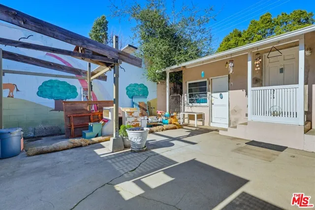 a living room with furniture wooden floor and a flat screen tv