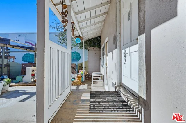 a kitchen with a stove a sink and a window