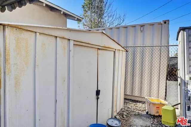 a kitchen with stainless steel appliances white cabinets a sink and a window