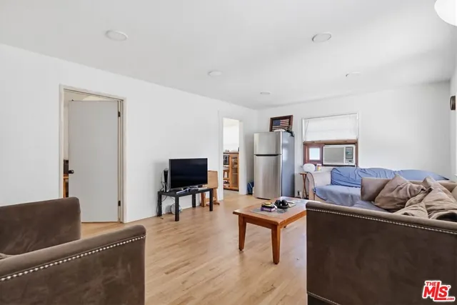 a bedroom with a bed and a chair