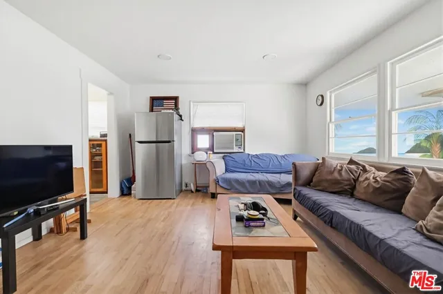 a bedroom with bed and a window