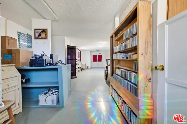 a room with furniture and a book shelf