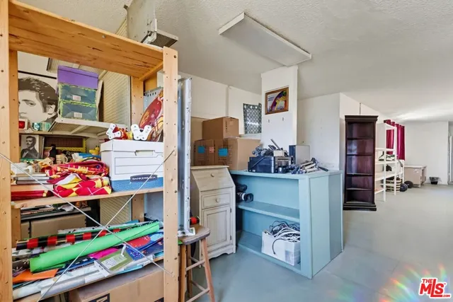 a room with furniture and a flat screen tv